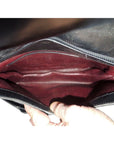 1970s GCCI saddle bag in black leather with muted gold hardware, an expandable bottom, wide shoulder strap, and burgundy leather lining