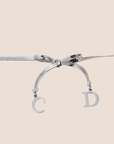 CHRISTIAN D1OR BOW SILVER NECKLACE