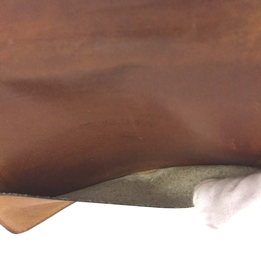 Early GCCI brown canvas with an orange diagonal GG logo print and camel leather bi-fold wallet