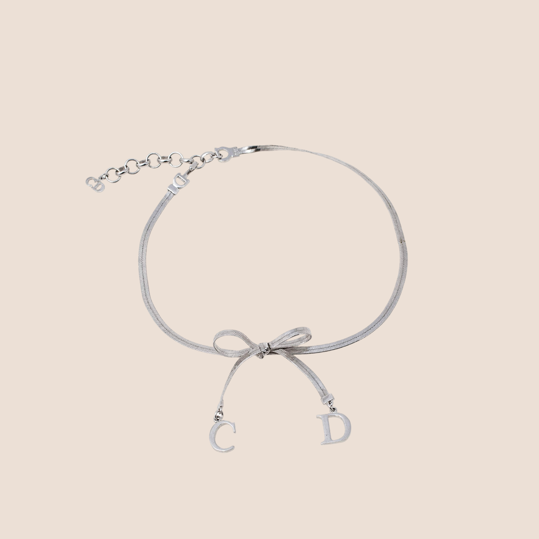 CHRISTIAN D1OR BOW SILVER NECKLACE