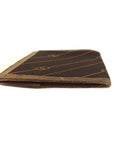 Early GCCI brown canvas with an orange diagonal GG logo print and camel leather bi-fold wallet