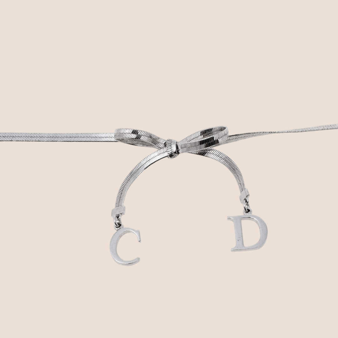 CHRISTIAN D1OR BOW SILVER NECKLACE