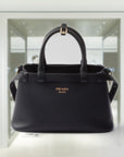 PRD Buckle small leather handbag with double belt